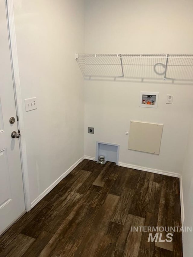laundry area featuring hookup for a washing machine, wood finished floors, hookup for a gas dryer, electric dryer hookup, and baseboards