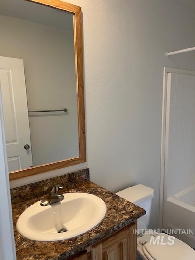 full bathroom featuring vanity and toilet