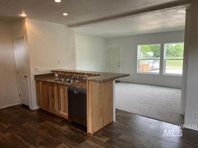 kitchen with dishwashing machine, recessed lighting, a peninsula, a sink, and dark stone counters