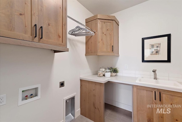 1469 E Andes Dr, Kuna, ID 83634 - washroom with cabinet space, hookup for an electric dryer, hookup for a washing machine, and tile patterned floors