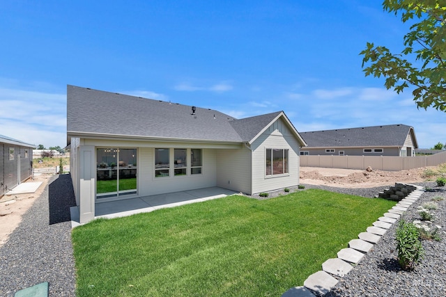 1469 E Andes Dr, Kuna, ID 83634 - rear view of house with a patio and a shingled roof