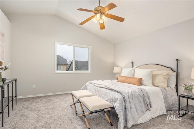 carpeted bedroom with lofted ceiling and ceiling fan