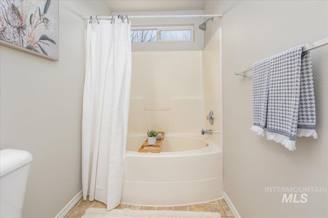 bathroom featuring tile patterned flooring and shower / bath combo with shower curtain