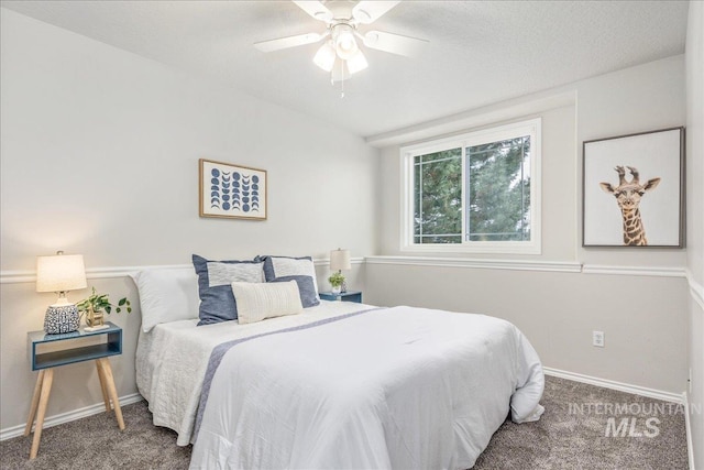 bedroom with ceiling fan and carpet flooring