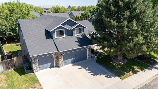 view of front facade featuring a garage and a front lawn