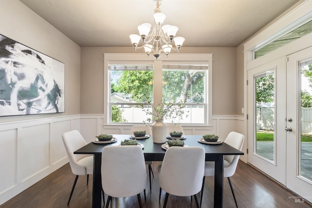1014 E Carter St, Boise, ID 83706 - dining space featuring a chandelier, french doors, dark wood-style flooring, a decorative wall, and a wainscoted wall