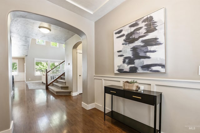 1014 E Carter St, Boise, ID 83706 - corridor featuring dark wood finished floors, arched walkways, and stairs