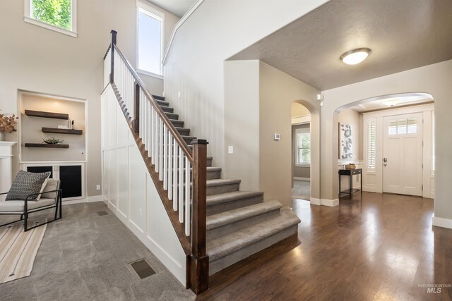 1014 E Carter St, Boise, ID 83706 - entrance foyer featuring arched walkways, stairs, and wood finished floors