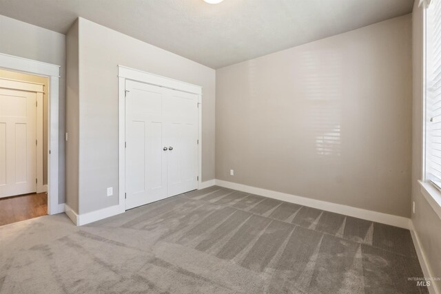 1014 E Carter St, Boise, ID 83706 - unfurnished bedroom featuring carpet and a closet