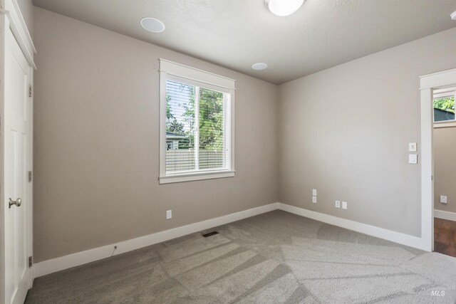 1014 E Carter St, Boise, ID 83706 - unfurnished bedroom with multiple windows and carpet floors
