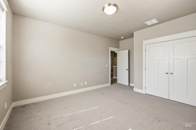 1014 E Carter St, Boise, ID 83706 - unfurnished bedroom with carpet flooring and a closet
