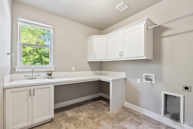 1014 E Carter St, Boise, ID 83706 - laundry area featuring cabinet space, hookup for an electric dryer, hookup for a washing machine, and a desk