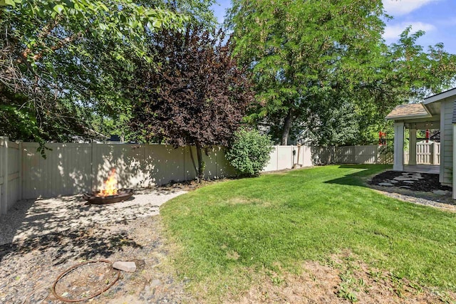 1014 E Carter St, Boise, ID 83706 - fenced backyard featuring a fire pit and a patio area