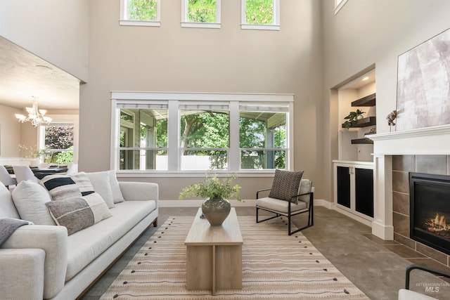1014 E Carter St, Boise, ID 83706 - living room featuring a towering ceiling, a tile fireplace, and a chandelier
