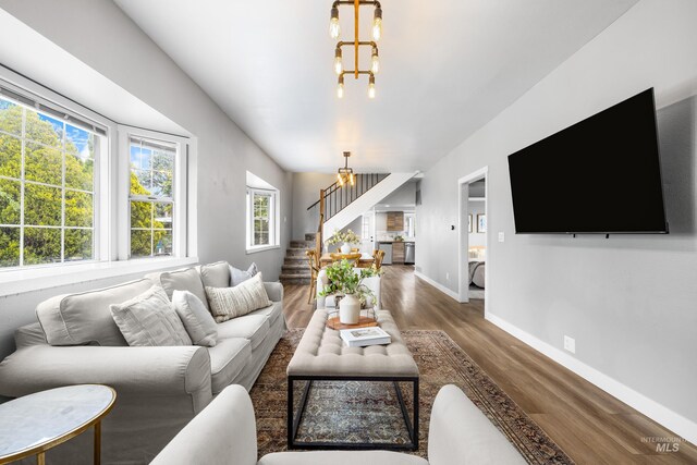 1936 S Leadville, Boise, ID 83706 - living area with a chandelier, stairway, wood finished floors, and baseboards