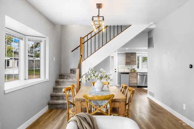1936 S Leadville, Boise, ID 83706 - dining room with baseboards, stairway, wood finished floors, and a chandelier