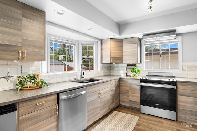 1936 S Leadville, Boise, ID 83706 - kitchen with stainless steel appliances, a sink, decorative backsplash, wood finished floors, and recessed lighting