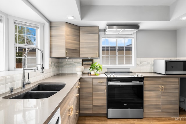 1936 S Leadville, Boise, ID 83706 - kitchen with stainless steel appliances, a sink, decorative backsplash, recessed lighting, and modern cabinets
