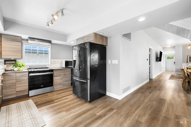 1936 S Leadville, Boise, ID 83706 - kitchen with stainless steel appliances, modern cabinets, light wood-style flooring, healthy amount of natural light, and recessed lighting