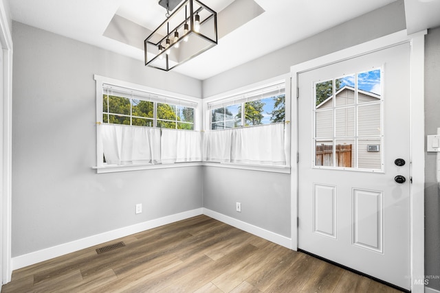 1936 S Leadville, Boise, ID 83706 - unfurnished dining area featuring a chandelier, wood finished floors, and baseboards