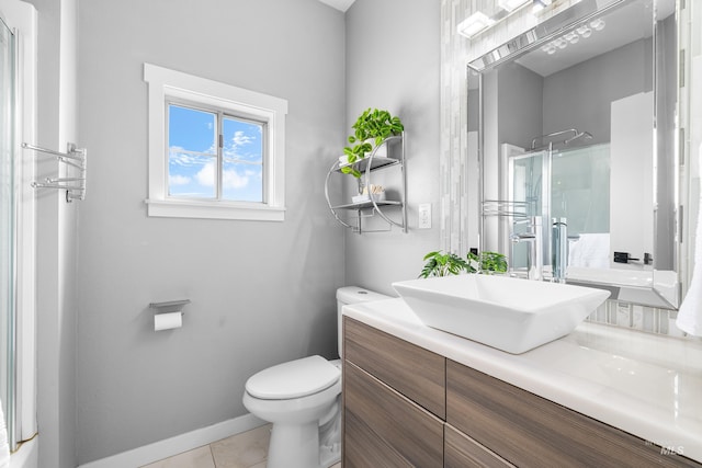 1936 S Leadville, Boise, ID 83706 - full bath featuring a shower stall, toilet, vanity, tile patterned flooring, and baseboards