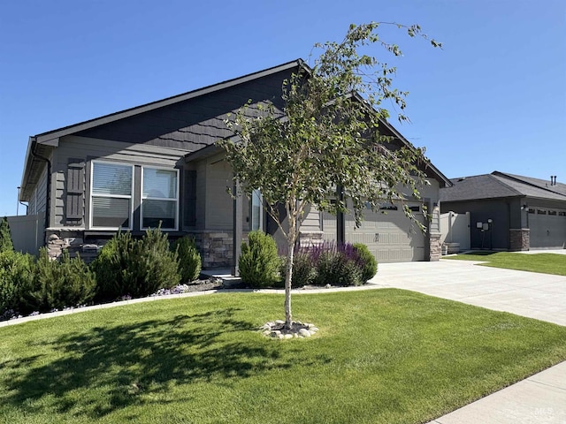 1786 E Cave Falls St, Kuna, ID 83634 - craftsman-style house featuring driveway, a garage, stone siding, and a front lawn