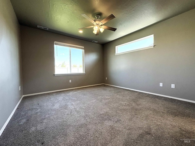 1786 E Cave Falls St, Kuna, ID 83634 - unfurnished room featuring ceiling fan, healthy amount of natural light, carpet, and baseboards