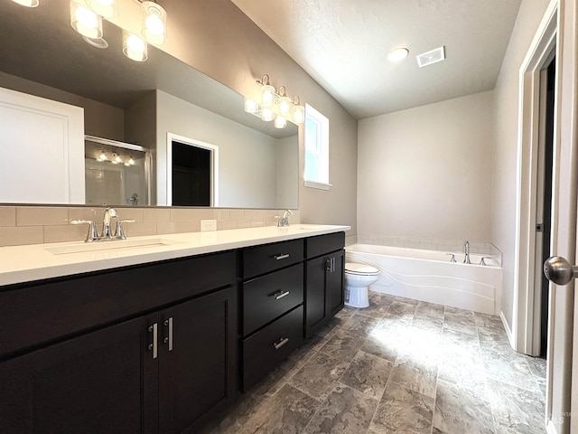 1786 E Cave Falls St, Kuna, ID 83634 - bathroom with double vanity, decorative backsplash, a bath, a shower stall, and toilet