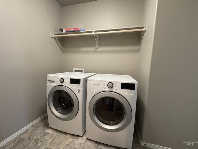 1786 E Cave Falls St, Kuna, ID 83634 - laundry room with washer and dryer and baseboards