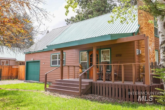 1102 Davis, Mccall, ID 83638 - rear view of property featuring metal roof and a chimney