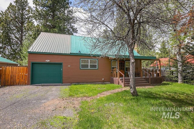 1102 Davis, Mccall, ID 83638 - chalet / cabin with a garage, metal roof, and driveway