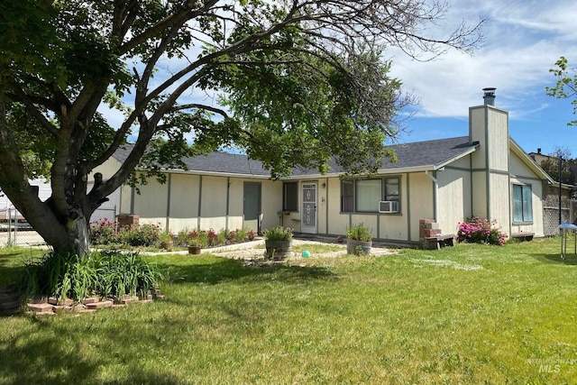 exterior space featuring a trampoline and a yard