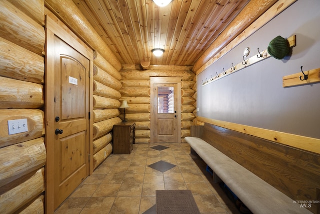 doorway featuring rustic walls and wood ceiling