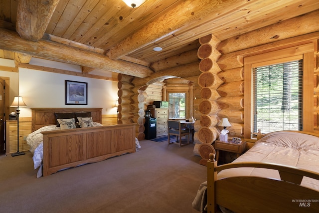 carpeted bedroom featuring beam ceiling, log walls, and wood ceiling