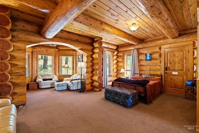 bedroom featuring beamed ceiling, carpet floors, rustic walls, and wood ceiling