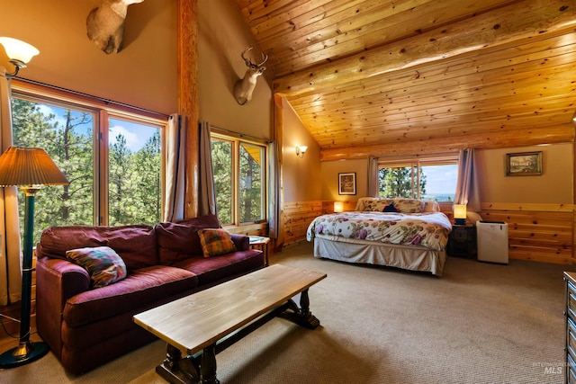 carpeted bedroom featuring high vaulted ceiling and wooden ceiling