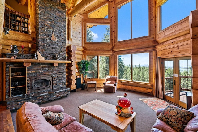 living room featuring a fireplace, french doors, and high vaulted ceiling