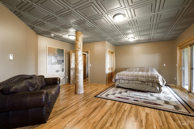 bedroom with hardwood / wood-style floors