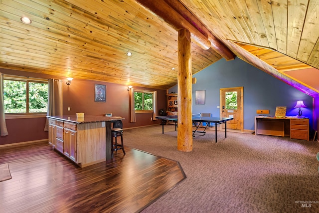 game room with a healthy amount of sunlight, vaulted ceiling with beams, and wooden ceiling