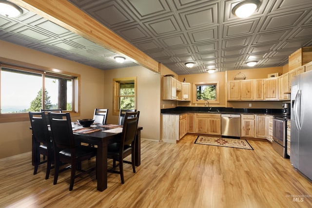 kitchen featuring light brown cabinets, stainless steel appliances, light hardwood / wood-style flooring, and sink