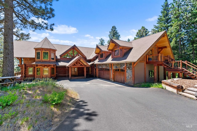 log cabin featuring a garage