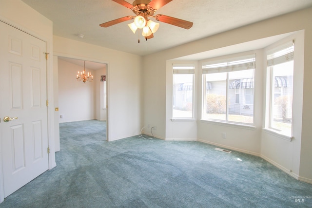 636 N Sterling St, Nampa, ID 83651 - carpeted empty room featuring visible vents, ceiling fan with notable chandelier, and baseboards