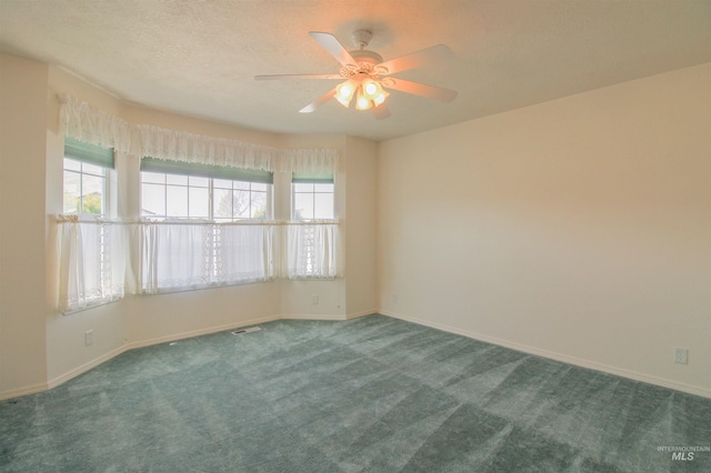 636 N Sterling St, Nampa, ID 83651 - carpeted empty room with visible vents, a textured ceiling, baseboards, and a ceiling fan