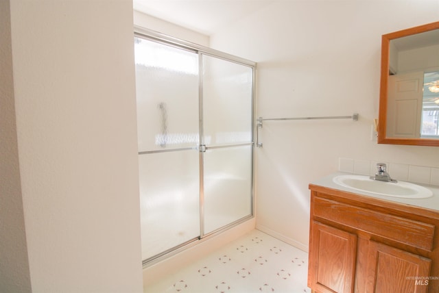 636 N Sterling St, Nampa, ID 83651 - bathroom featuring vanity, tile patterned floors, and a stall shower