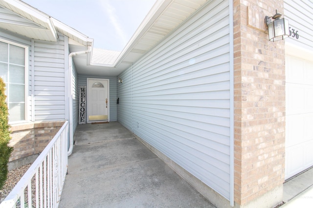 636 N Sterling St, Nampa, ID 83651 - property entrance with a garage and brick siding