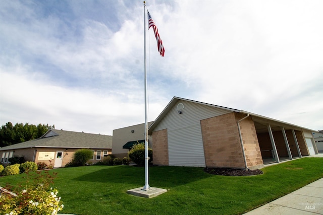 636 N Sterling St, Nampa, ID 83651 - view of side of property with a lawn