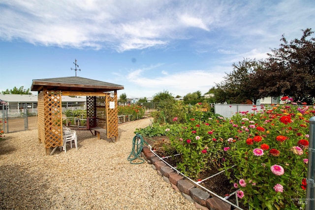 636 N Sterling St, Nampa, ID 83651 - view of yard featuring a gazebo, a vegetable garden, and fence