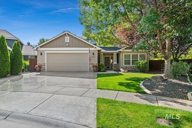 5315 N Red Hills Pl, Meridian, ID 83646 - view of front of property with stone siding, an attached garage, concrete driveway, and board and batten siding