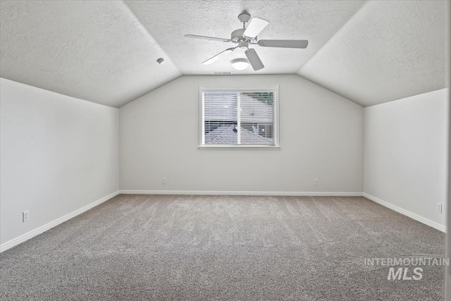 5315 N Red Hills Pl, Meridian, ID 83646 - bonus room with a textured ceiling, lofted ceiling, carpet floors, and ceiling fan