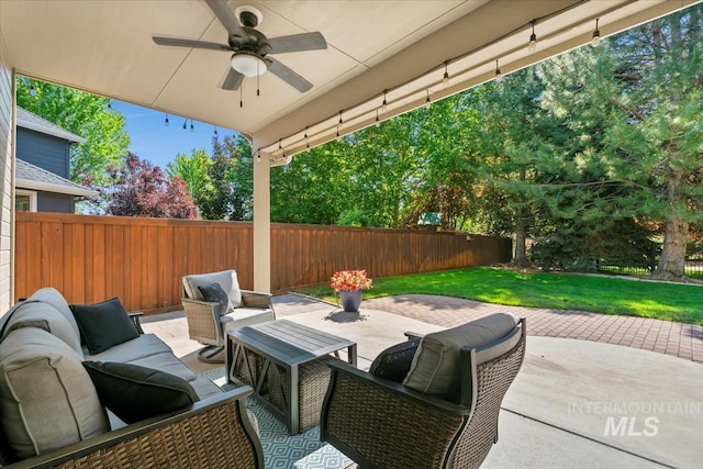 5315 N Red Hills Pl, Meridian, ID 83646 - fenced backyard with a patio, a ceiling fan, and an outdoor living space